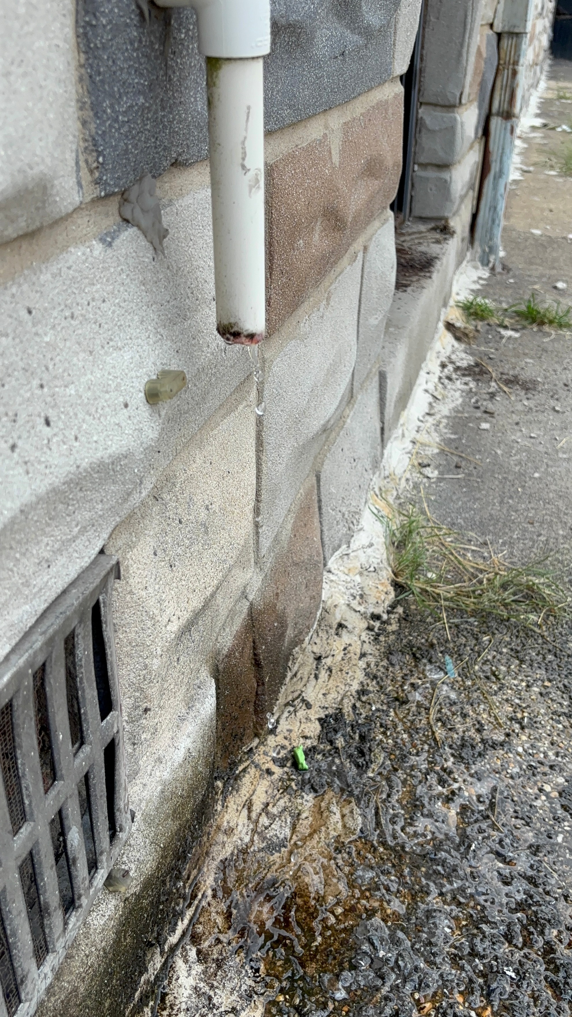 Downspout drainage directing water away from a home foundation