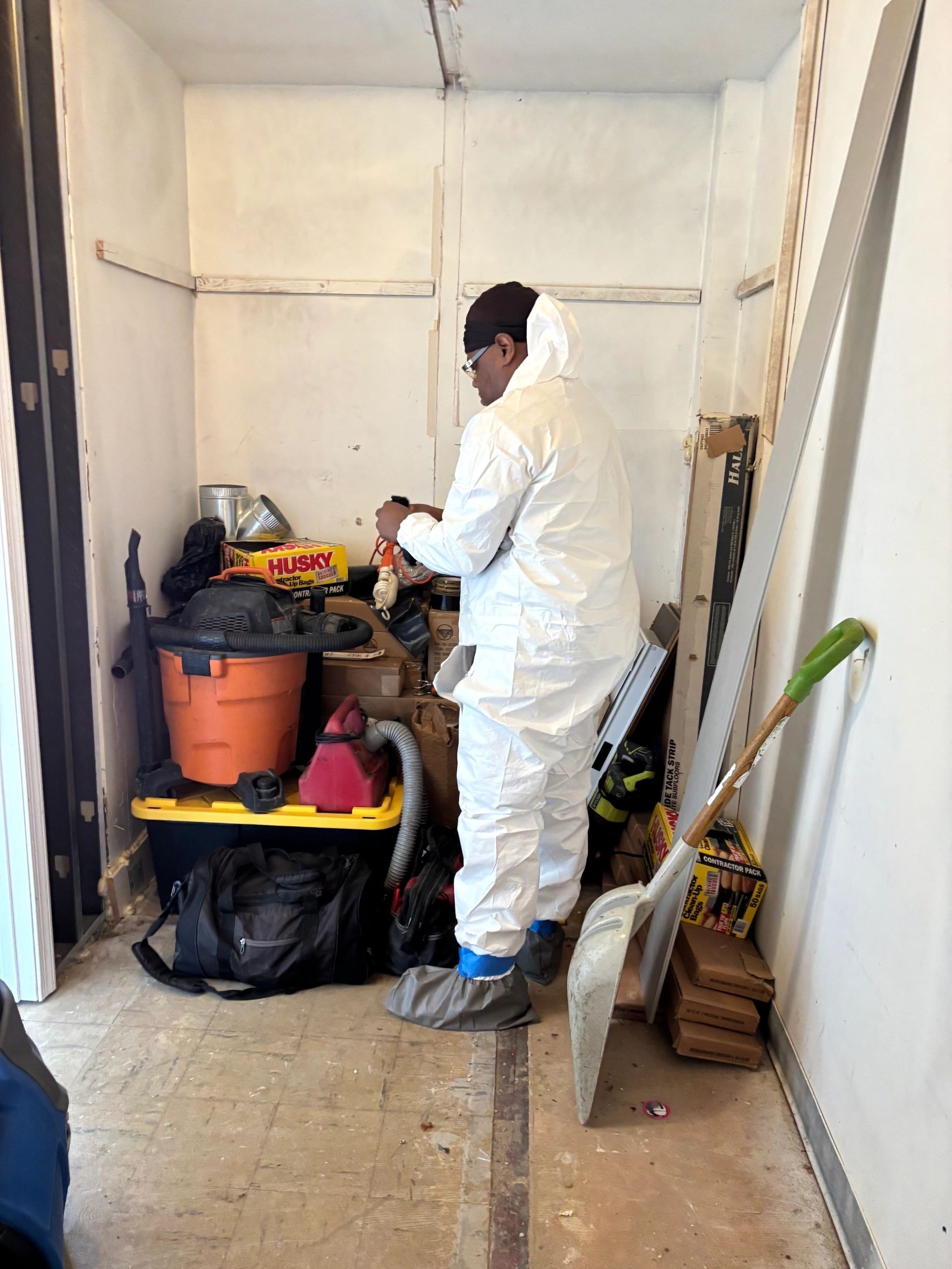 Remediation professional preparing equipment